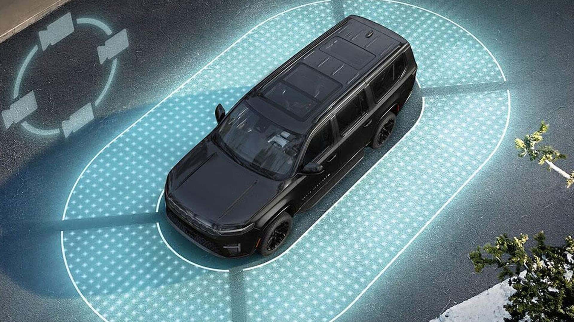 Overhead view of a black SUV surrounded by illuminated blue zones and directional arrow graphics.