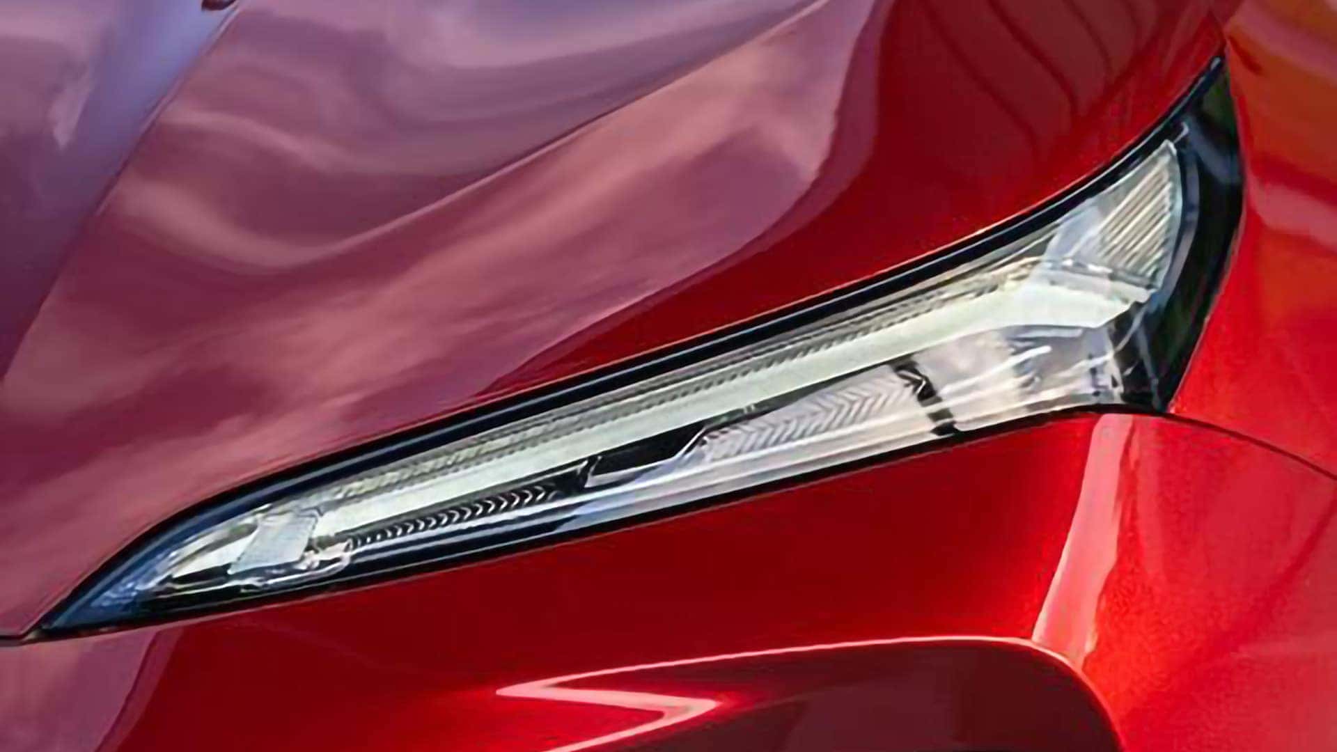 Close-up of the 2026 Buick Envision LED daytime running lamp and sculpted hood