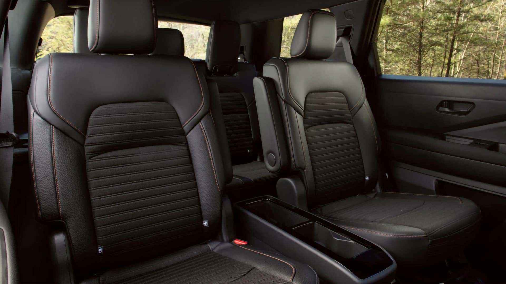 2026 Nissan Pathfinder interior with black second-row captain’s chairs and third-row seating