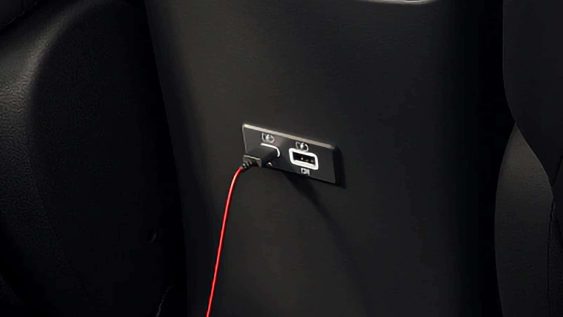 Rear USB-A and USB-C charging ports inside the 2026 Nissan Sentra