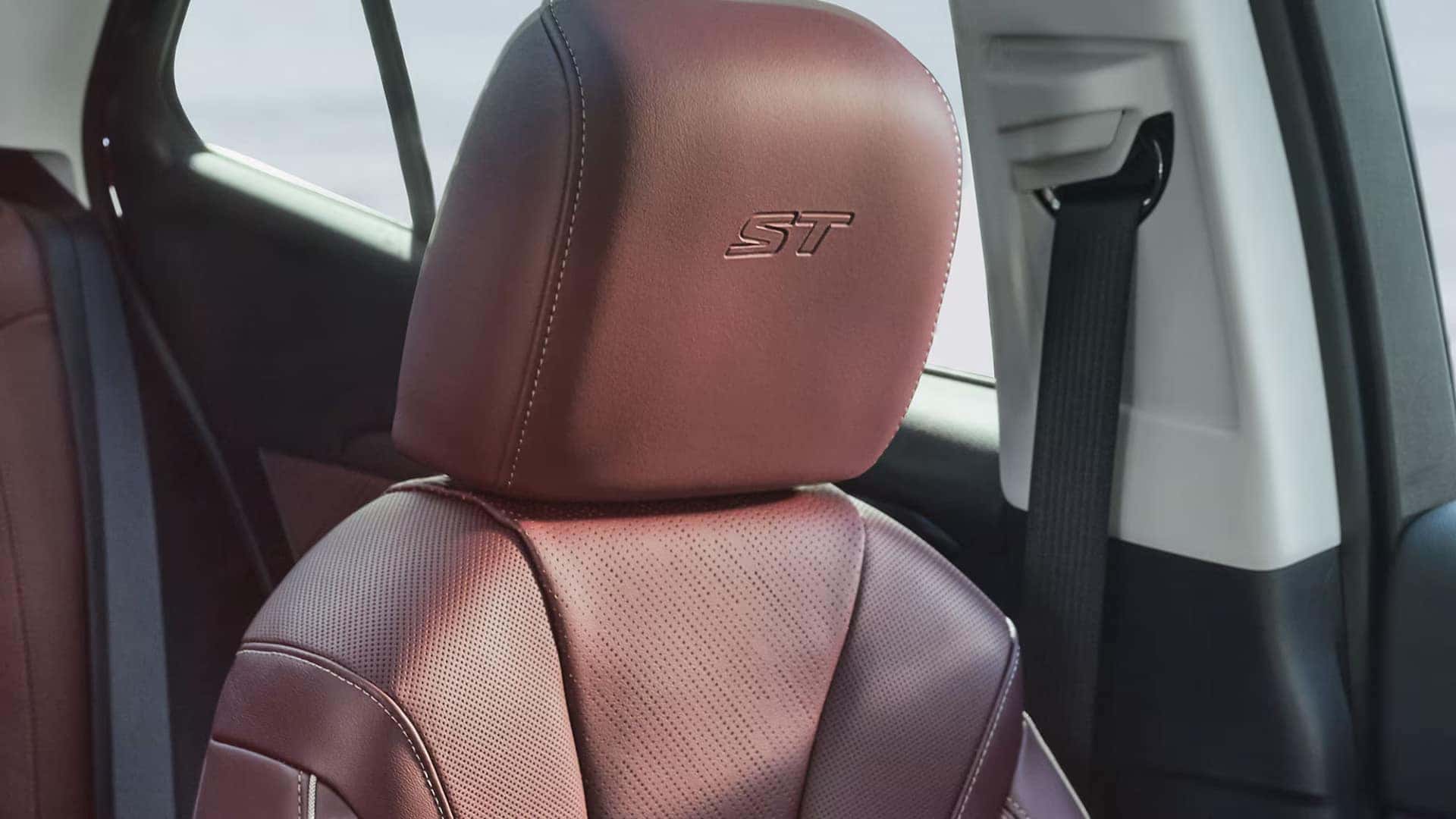 Burgundy perforated front seat with embroidered ST logo in the 2026 Buick Envision Sport Touring