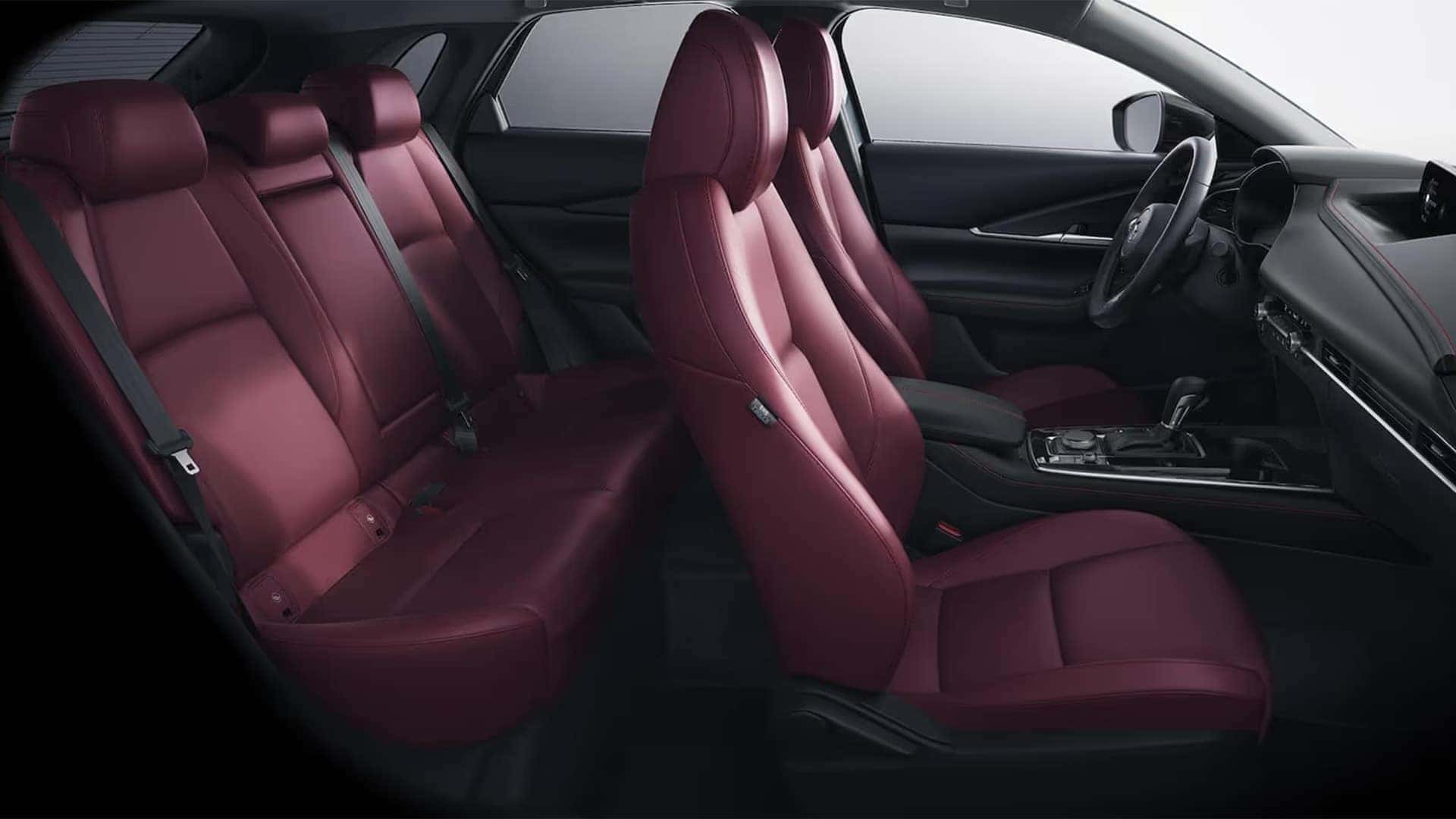 2026 Mazda CX-30 cabin with two rows of red leather seating for up to five passengers
