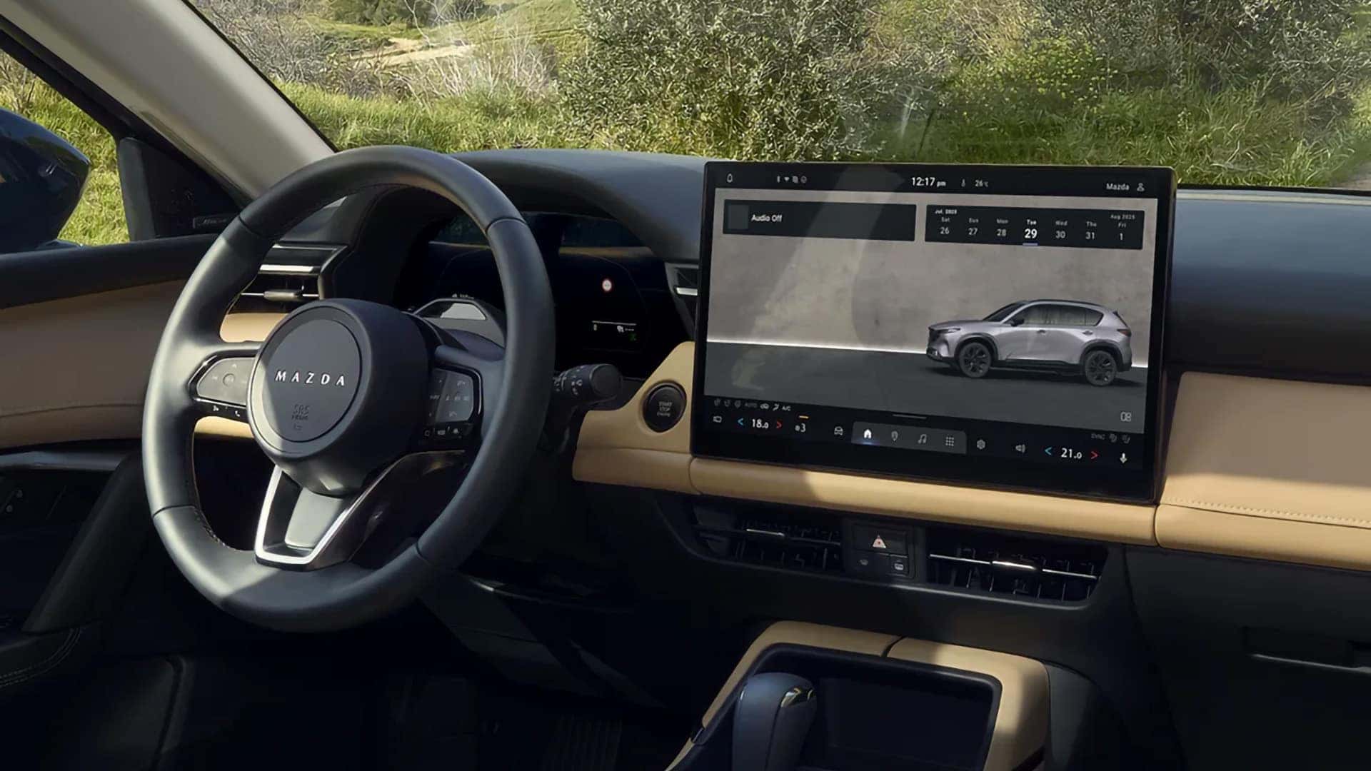 2026 Mazda CX-5 steering wheel, digital gauge cluster, and center touchscreen