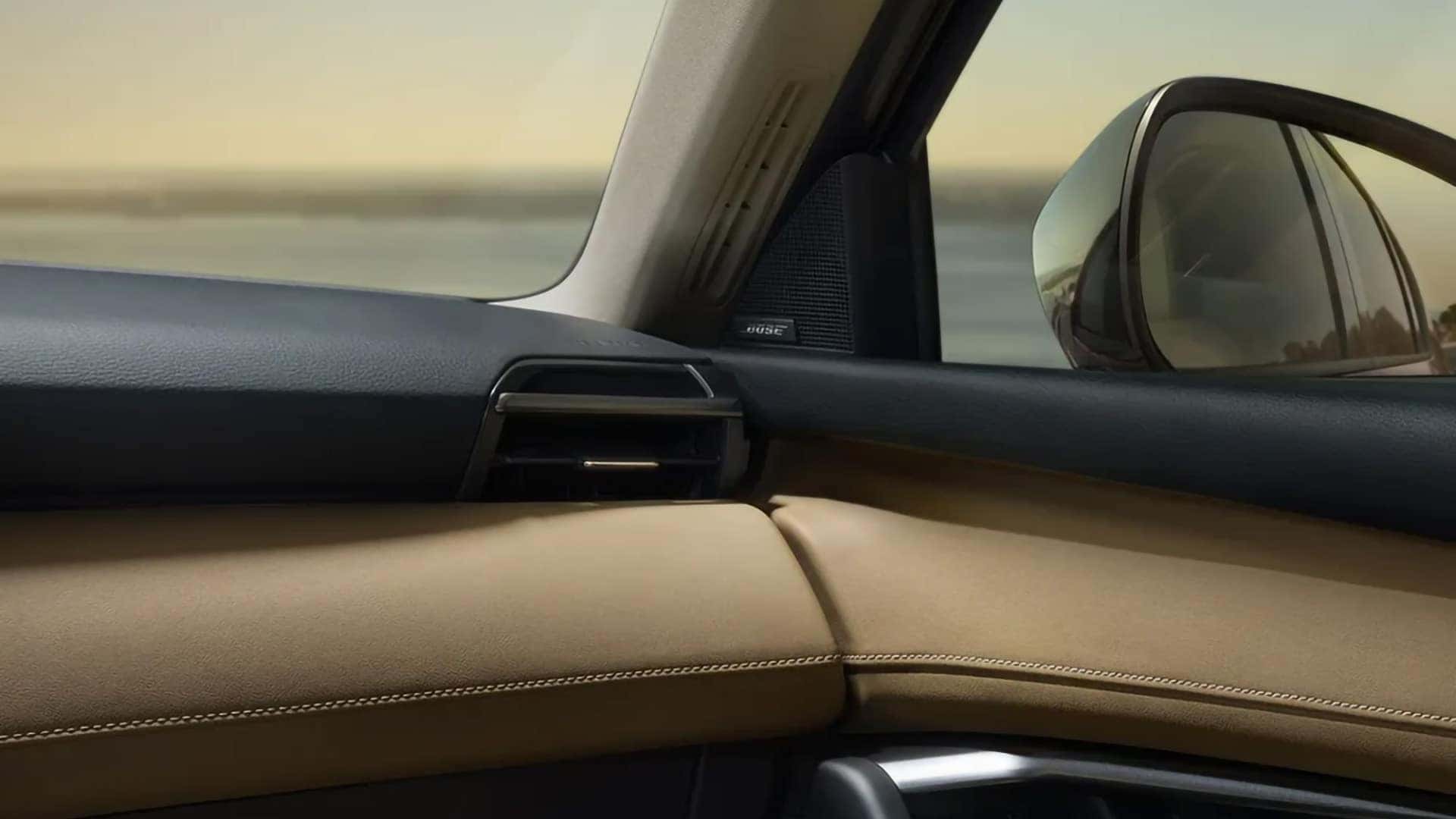 Bose audio speaker mounted beside the front passenger door in the 2026 Mazda CX-5