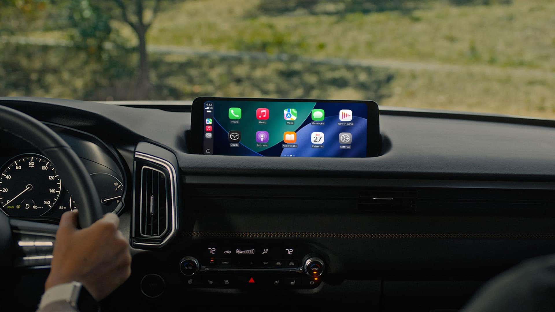 2026 Mazda CX-50 Hybrid dashboard with Apple CarPlay displayed on the infotainment screen