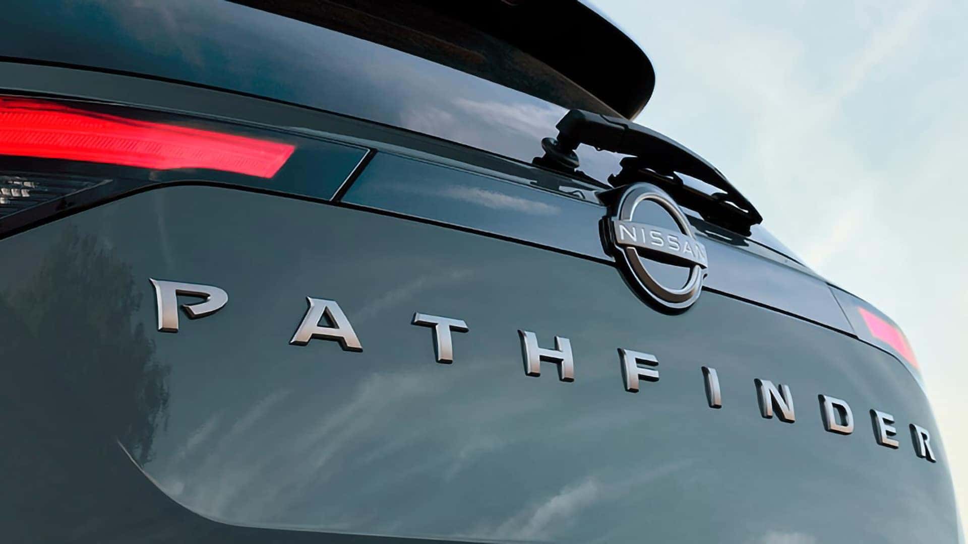 Close-up of the 2026 Nissan Pathfinder rear liftgate with illuminated taillights and Pathfinder badging