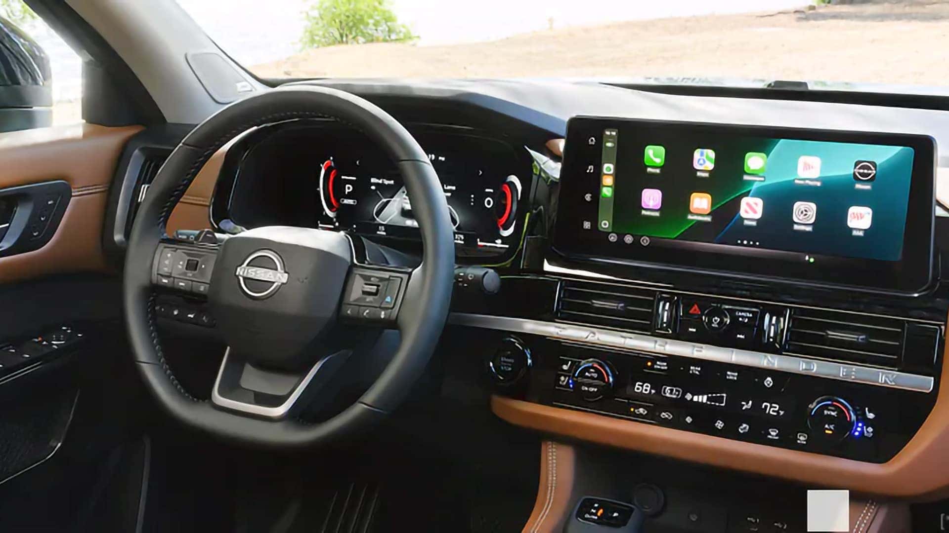 2026 Nissan Pathfinder dashboard with digital gauges and a touchscreen displaying wireless Apple CarPlay