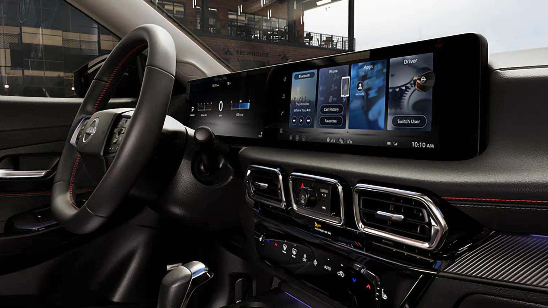 2026 Nissan Sentra dashboard with a digital driver display, touchscreen infotainment system, and steering wheel.
