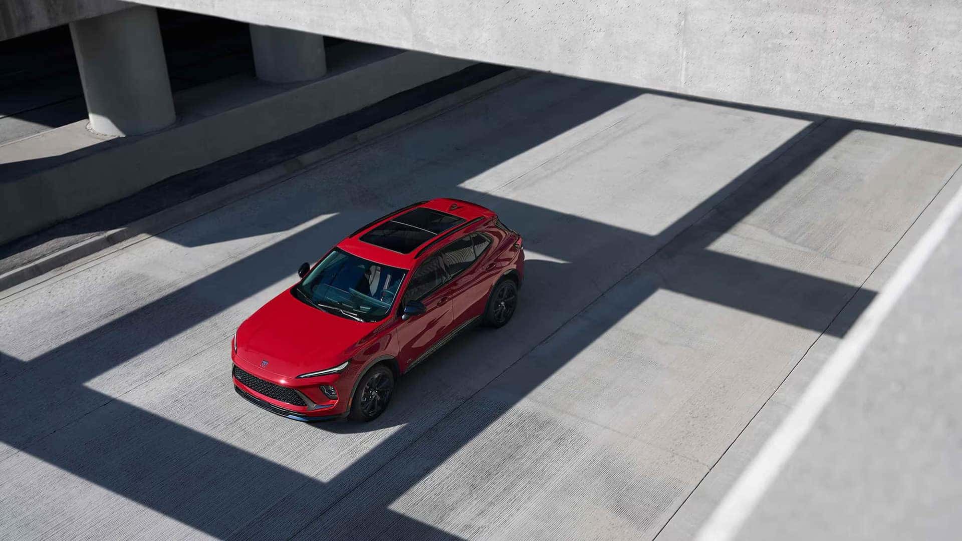 Overhead view of a red 2026 Buick Envision Sport Touring with a panoramic moonroof