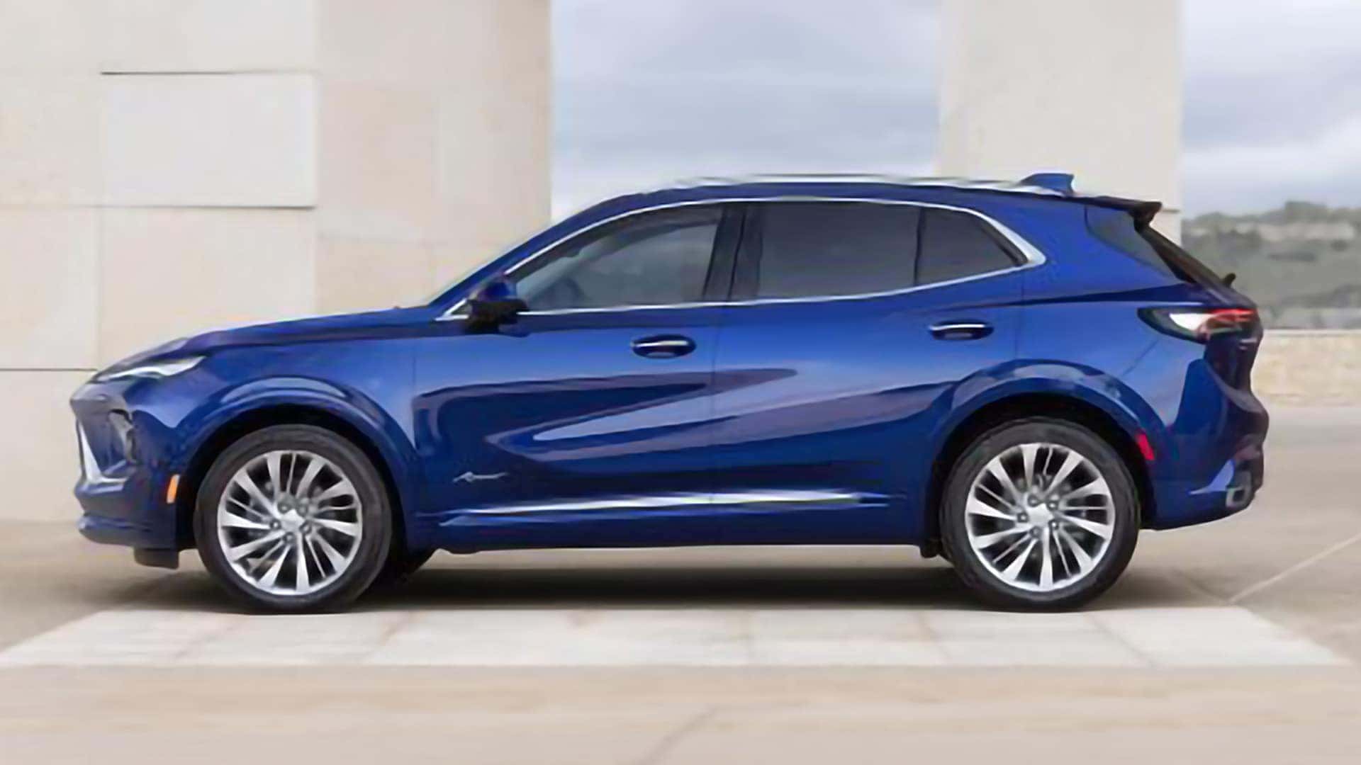 Blue 2026 Buick Envision Avenir in side profile with chrome accents and 20-inch alloy wheels