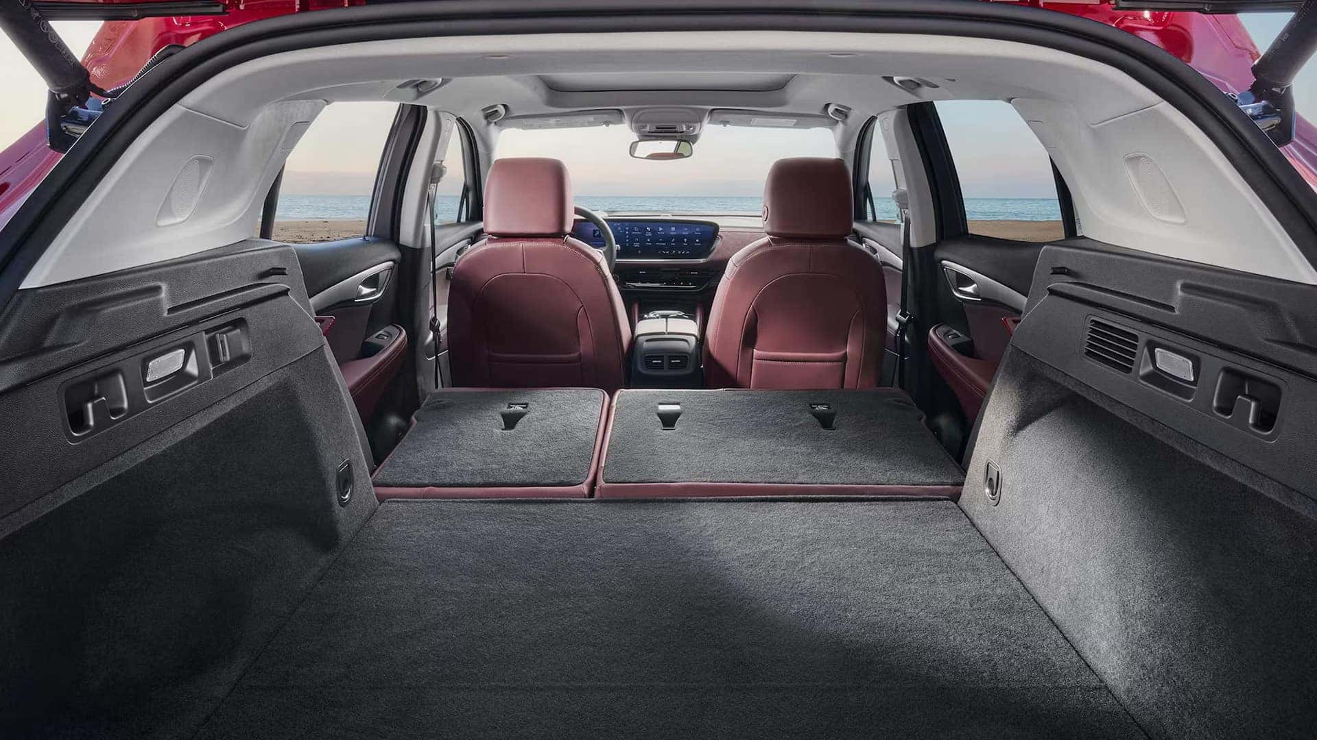 2026 Buick Envision cargo area with rear seats folded flat and front cabin visible