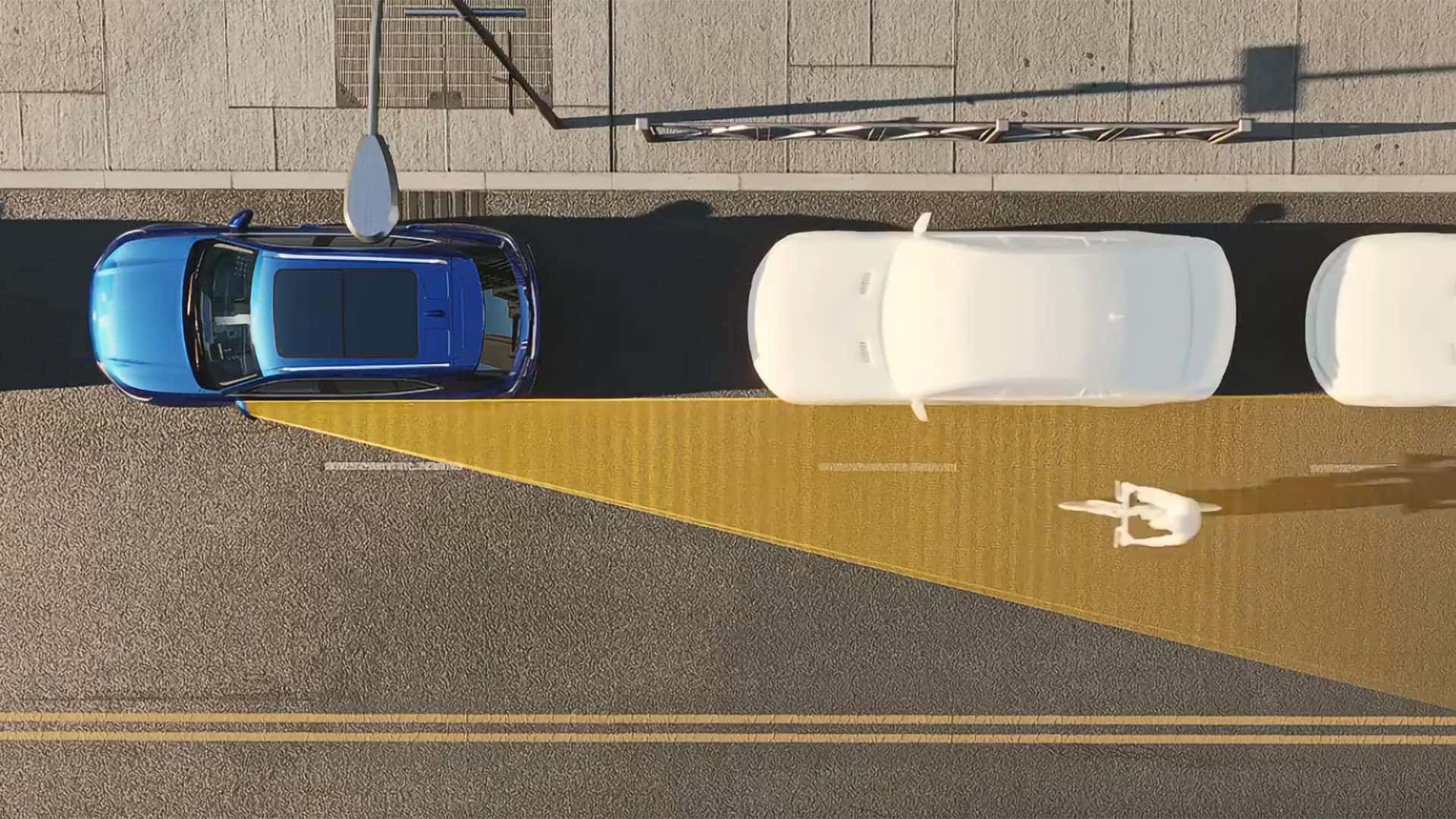 Overhead illustration of 2026 Buick Envision safety technology detecting a bicyclist beside parked vehicles