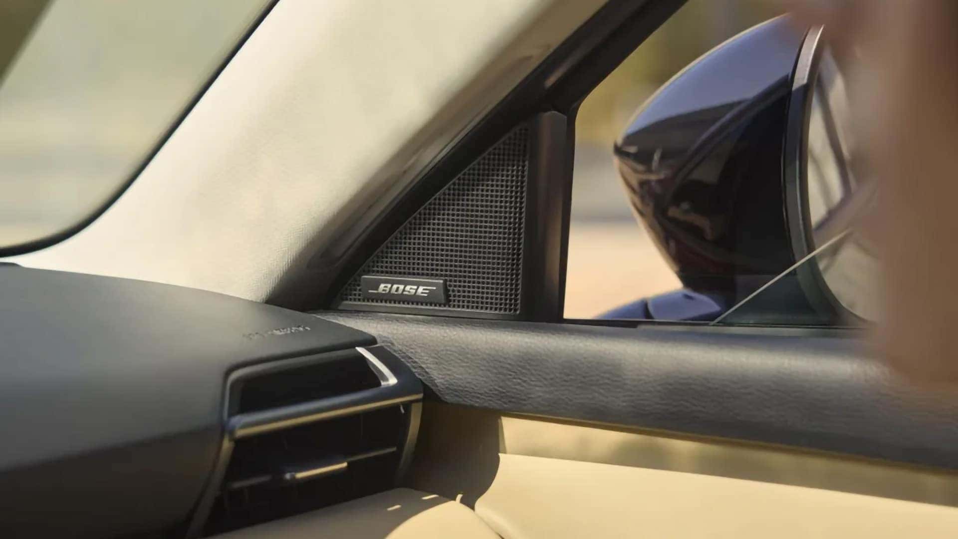 Close-up of a Bose audio speaker beside the dashboard in the 2026 Mazda CX-5