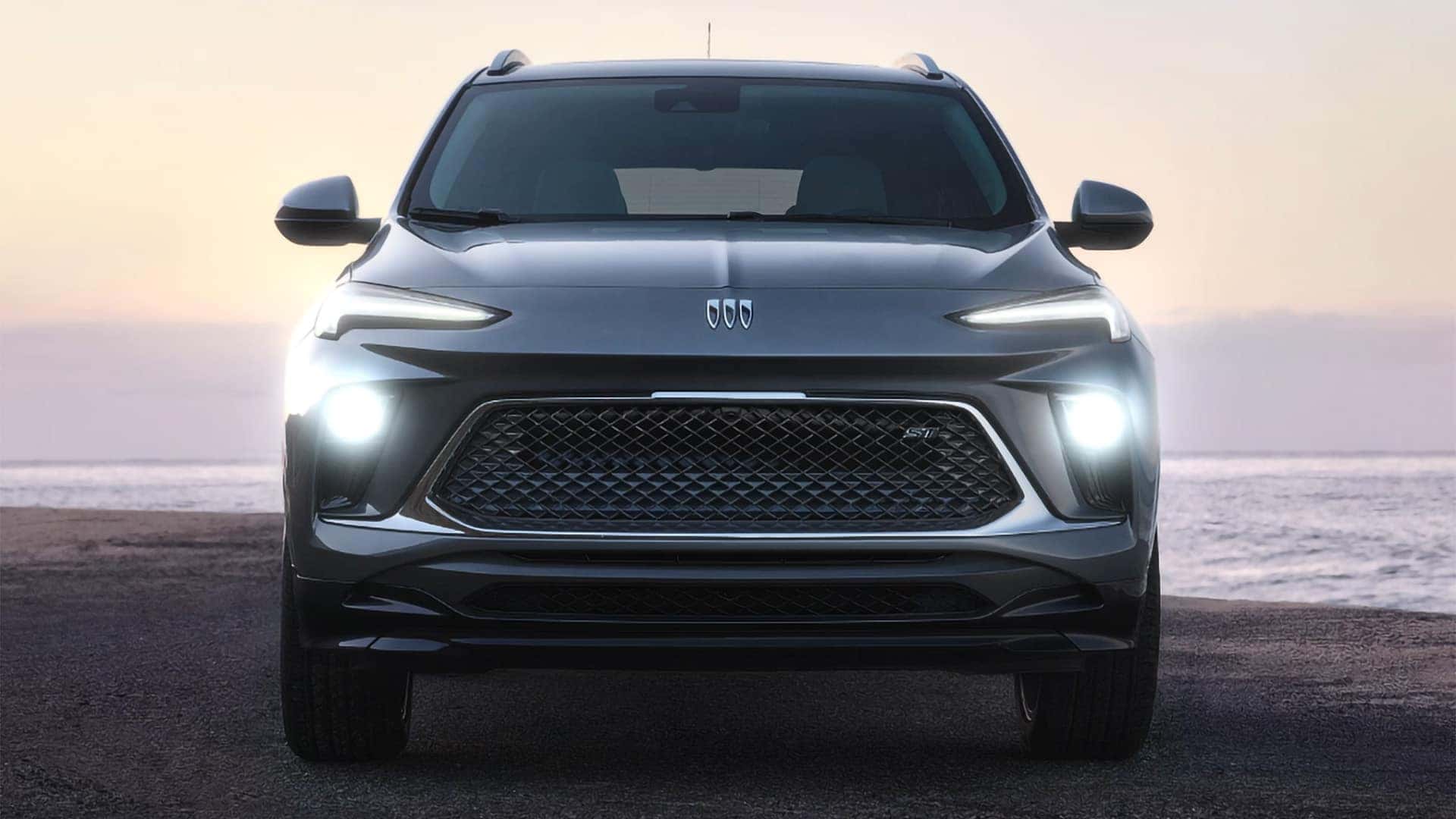 Front view of a 2026 Buick Encore GX Sport Touring with LED lighting and signature grille