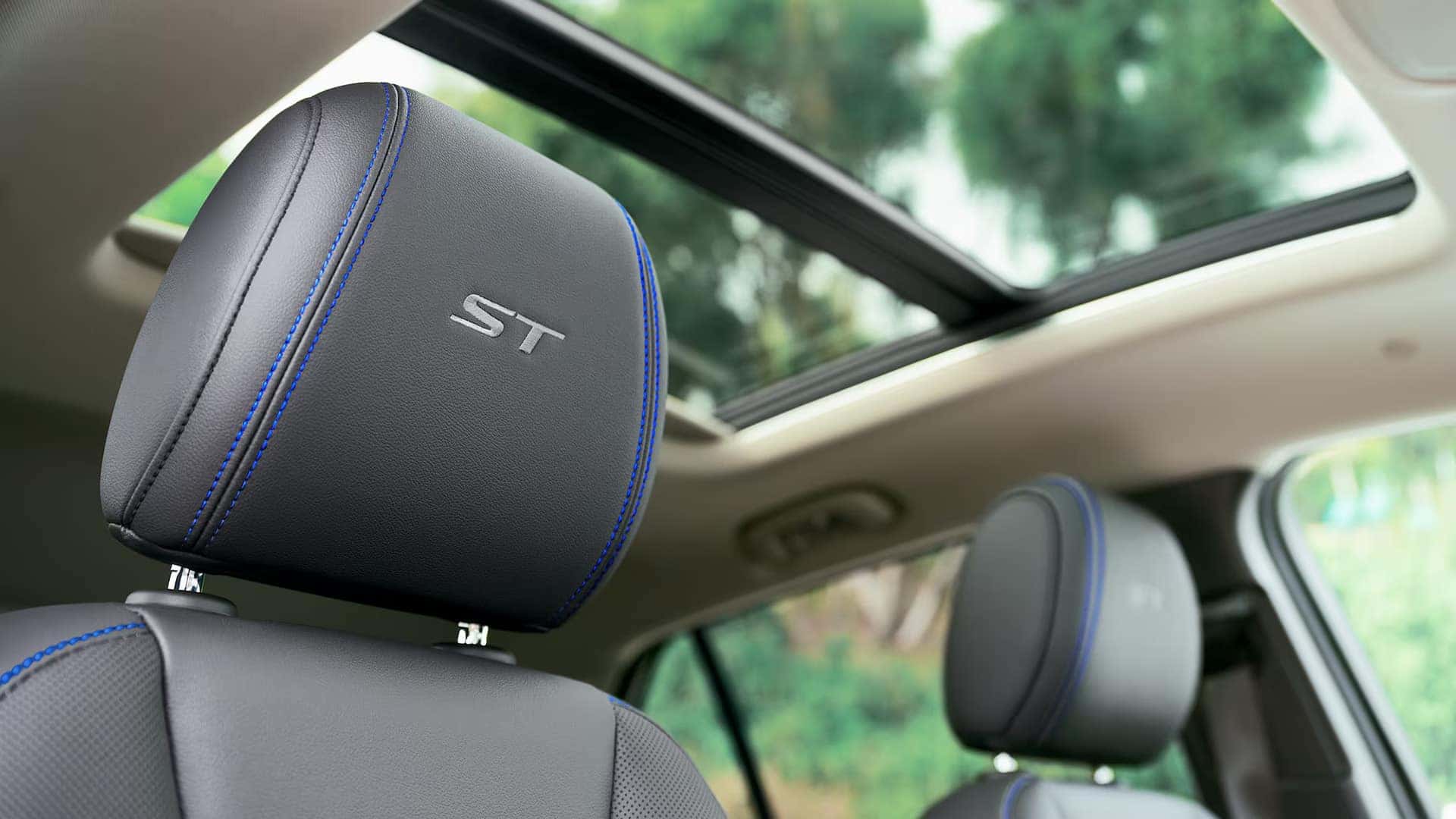 2026 Buick Encore GX Sport Touring head restraint with embroidered ST logo and blue stitching