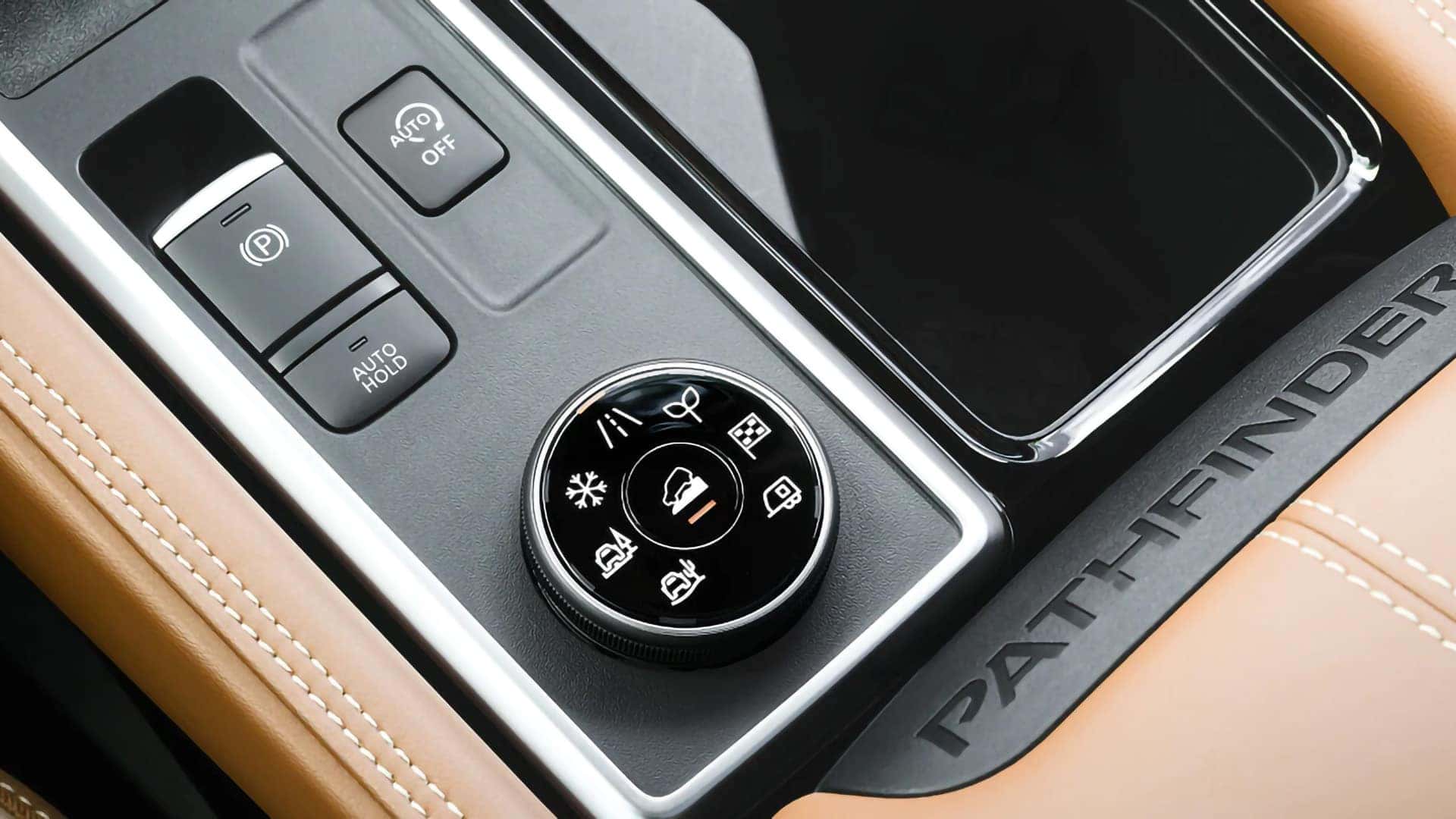 2026 Nissan Pathfinder center console with selectable drive-mode dial and electronic parking brake controls