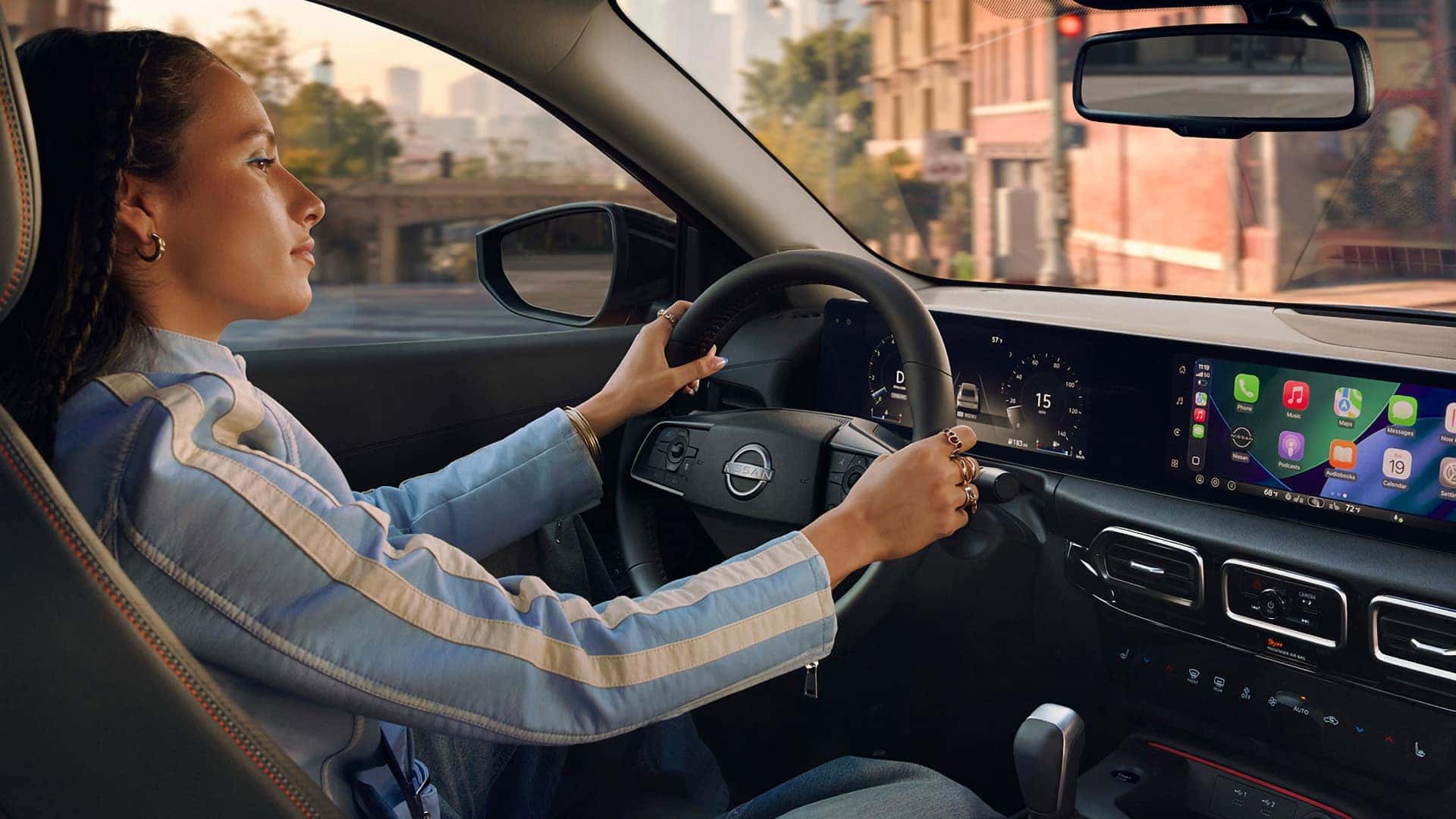 Driver using Apple CarPlay on the 2026 Nissan Sentra infotainment display