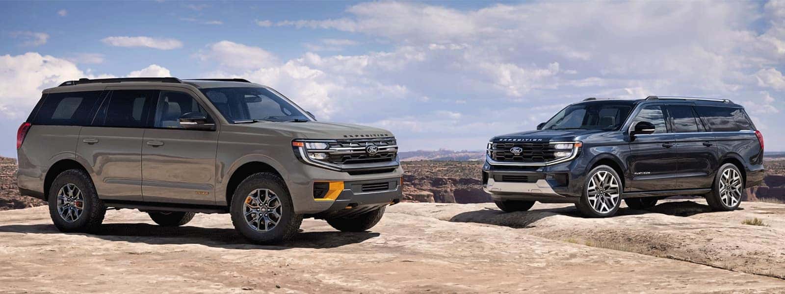 2026 Ford Expedition Tremor and Platinum SUVs parked on rocky terrain