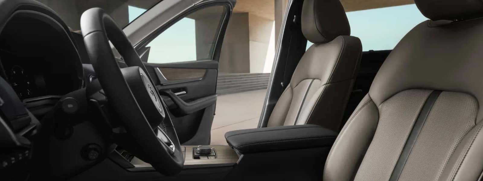2026 Mazda CX-70 PHEV front cabin with leather-trimmed seats, steering wheel, and center console