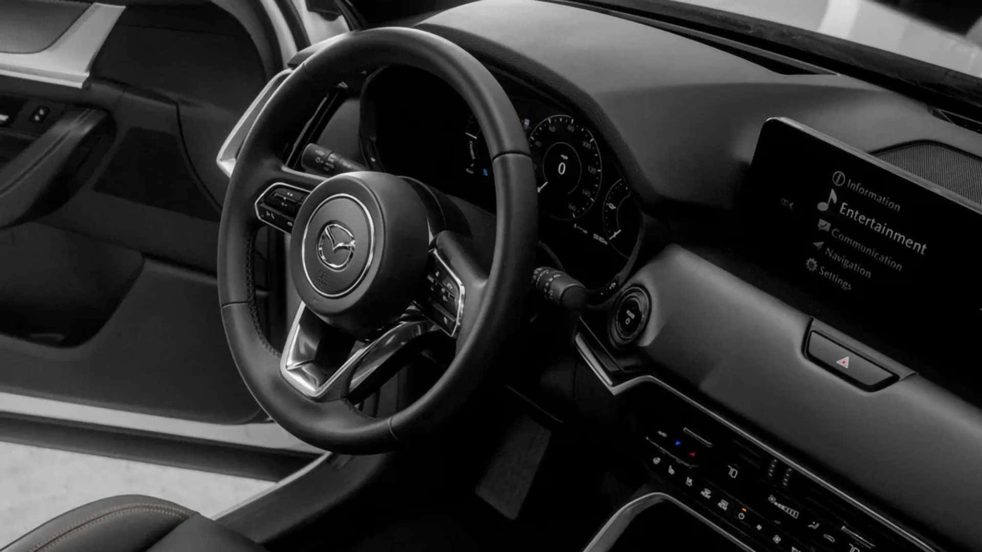 2026 Mazda CX-70 PHEV cockpit with digital gauge cluster and center infotainment display