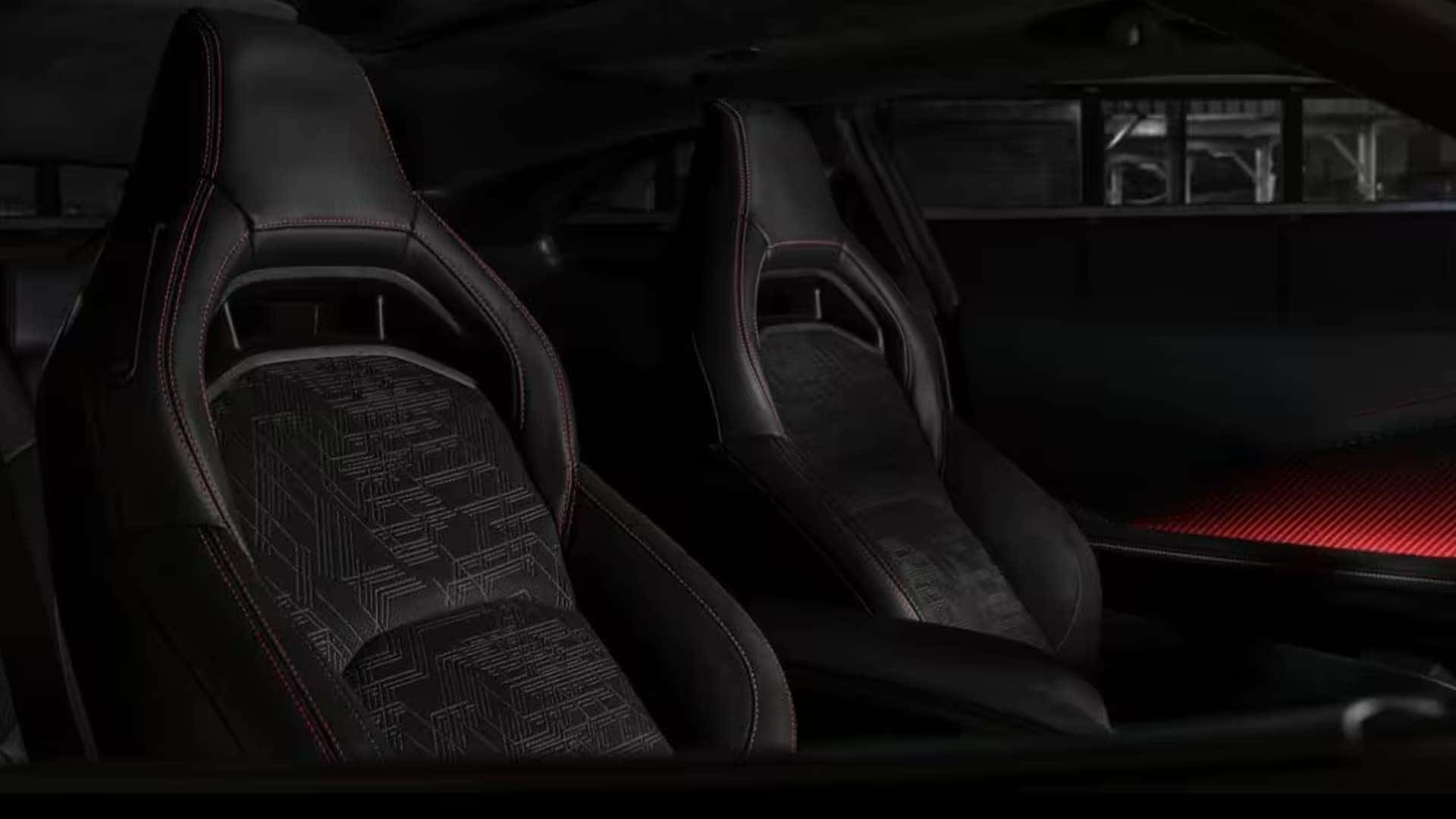 Black Dodge Charger front sport seats with patterned inserts, red stitching and red ambient lighting on the passenger door.