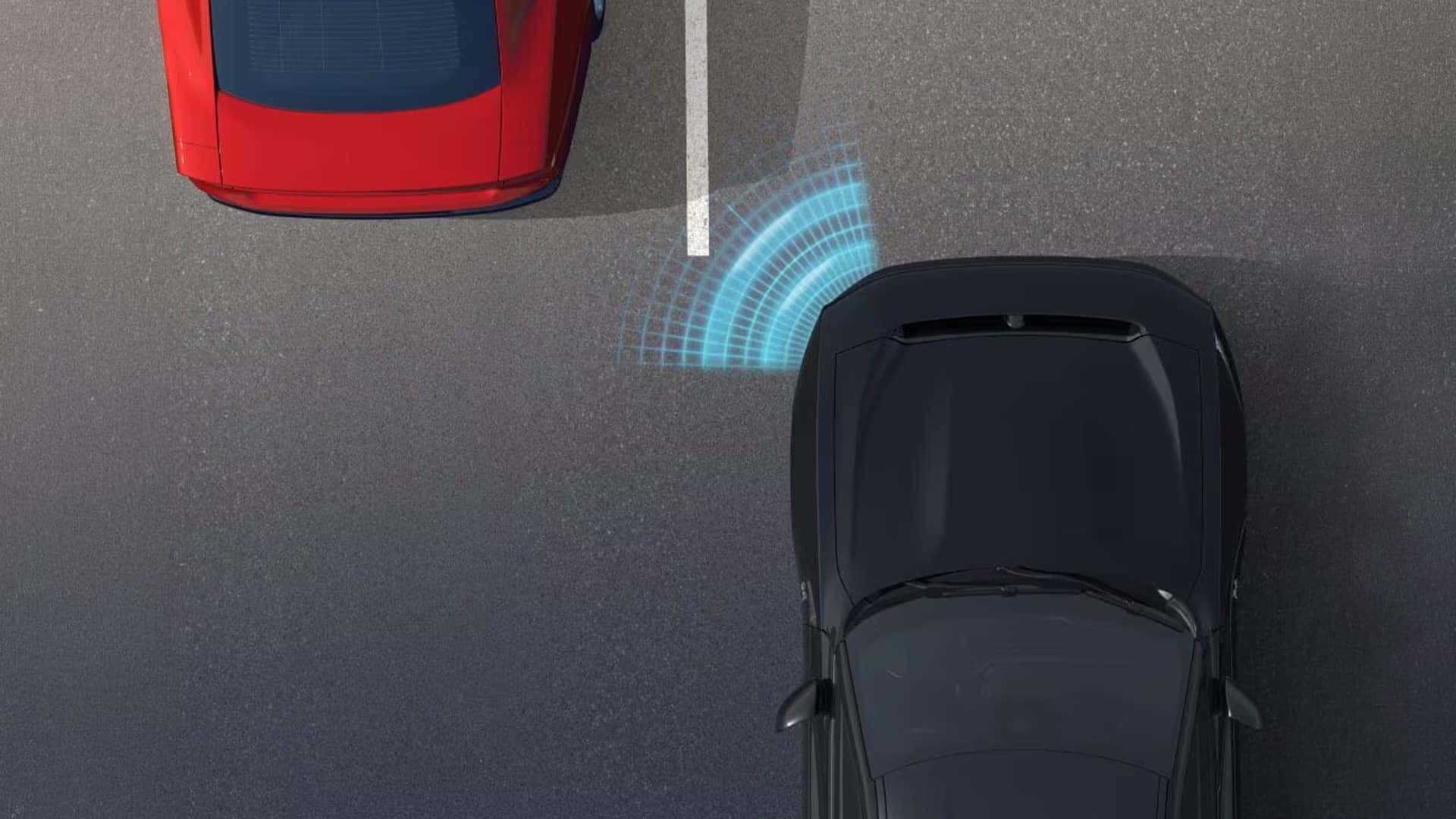 Overhead view of a black Dodge Charger beside a red Dodge Charger with blue sensor graphics between the vehicles.