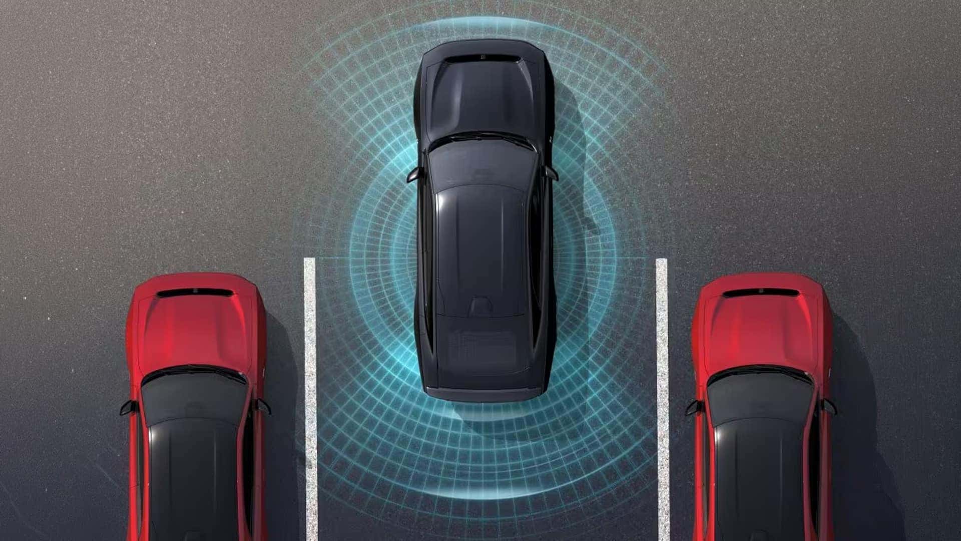 Top-down view of a black car between two red cars with blue sensor graphics surrounding the black car.