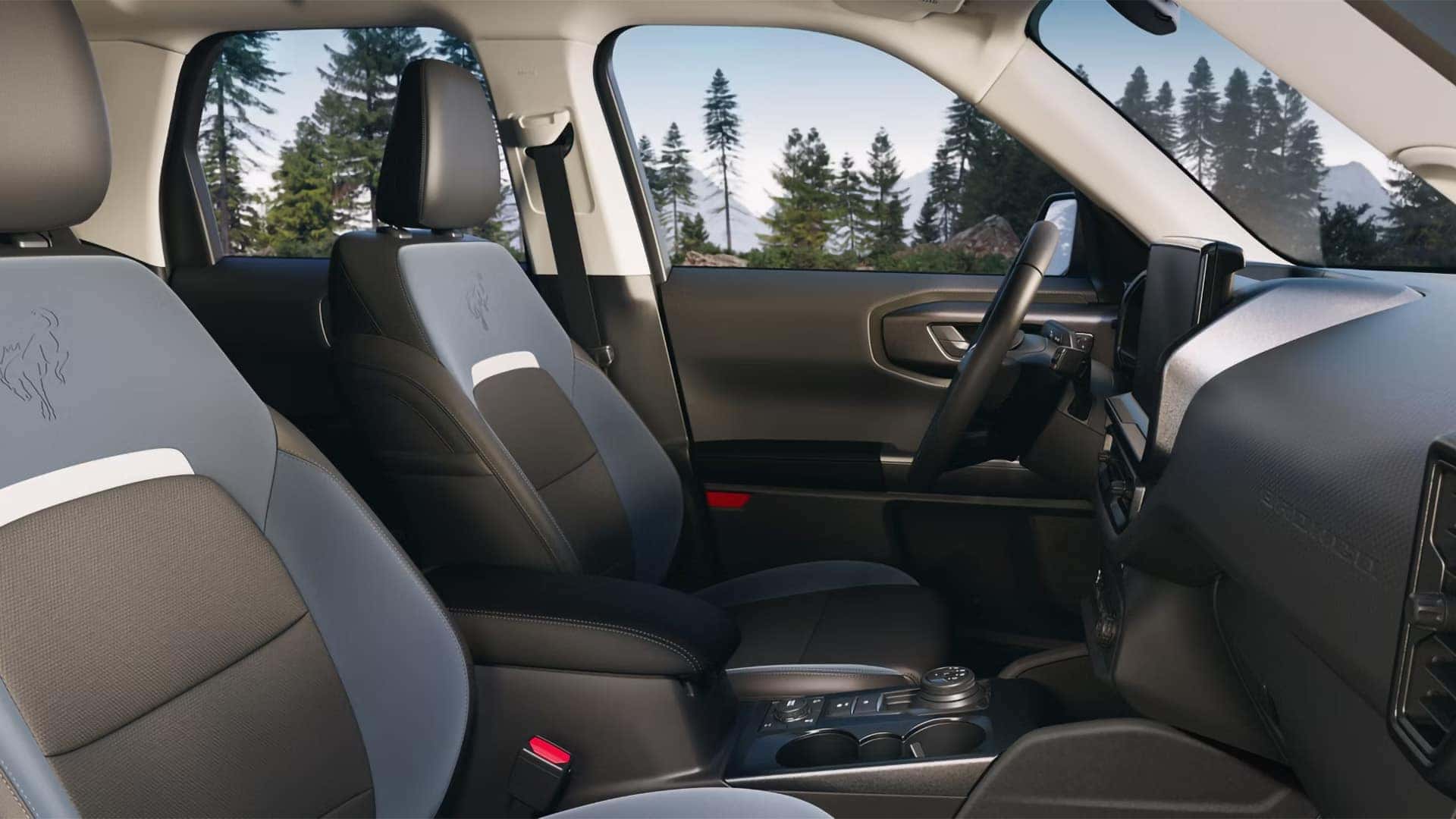 Front seating, center console, and dashboard inside a 2026 Ford Bronco Sport