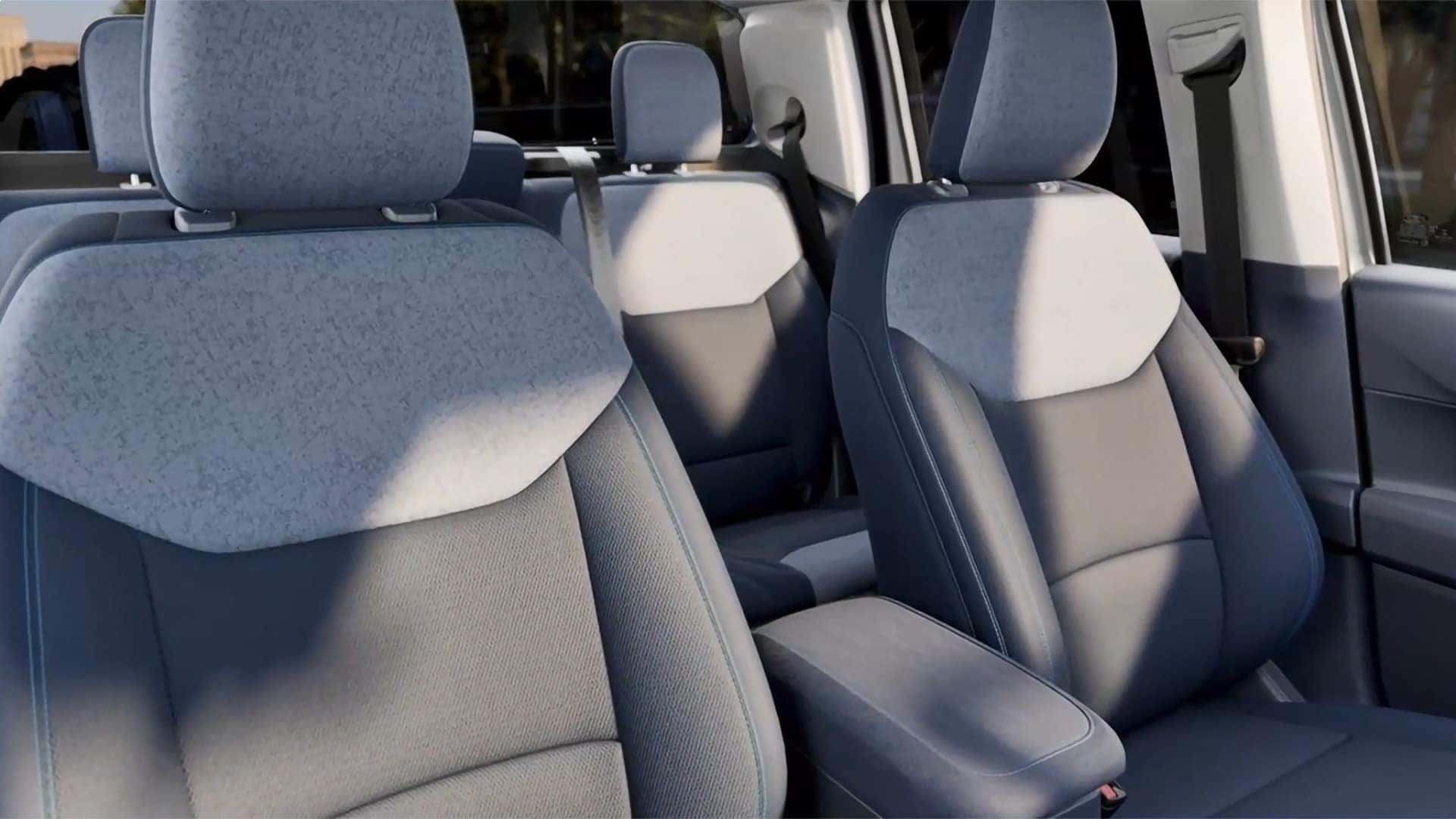 Cloth front seats and rear bench inside a 2026 Ford Maverick