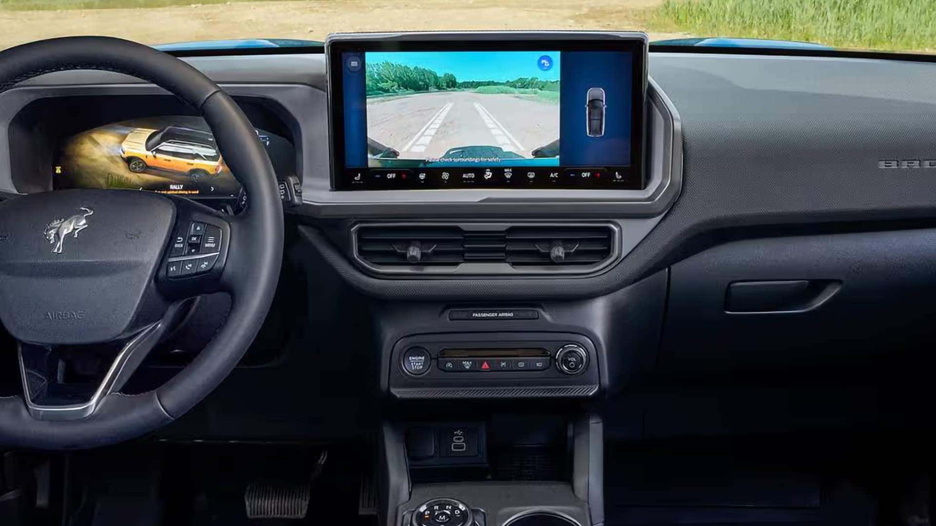 Ford Bronco Sport touchscreen showing a forward trail camera view with tire path guidelines
