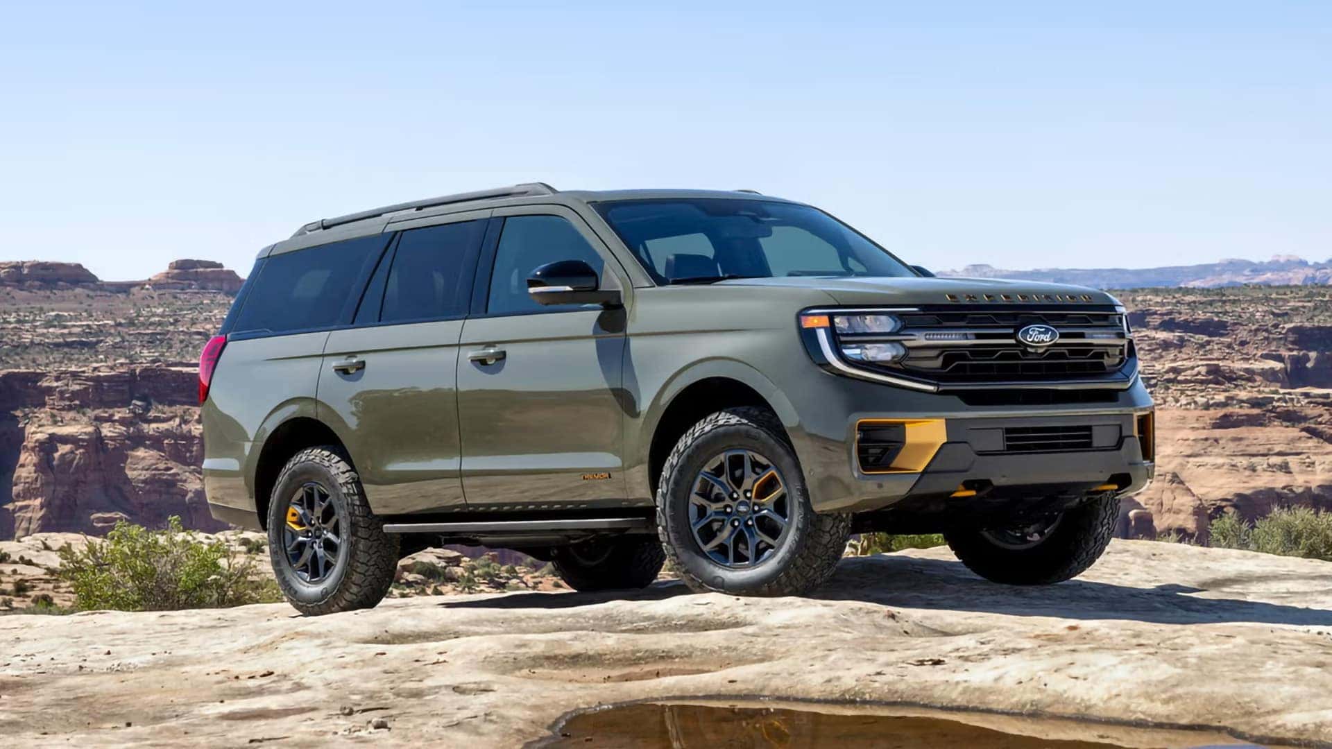 2026 Ford Expedition Tremor parked on rocky terrain with all-terrain tires and off-road wheels