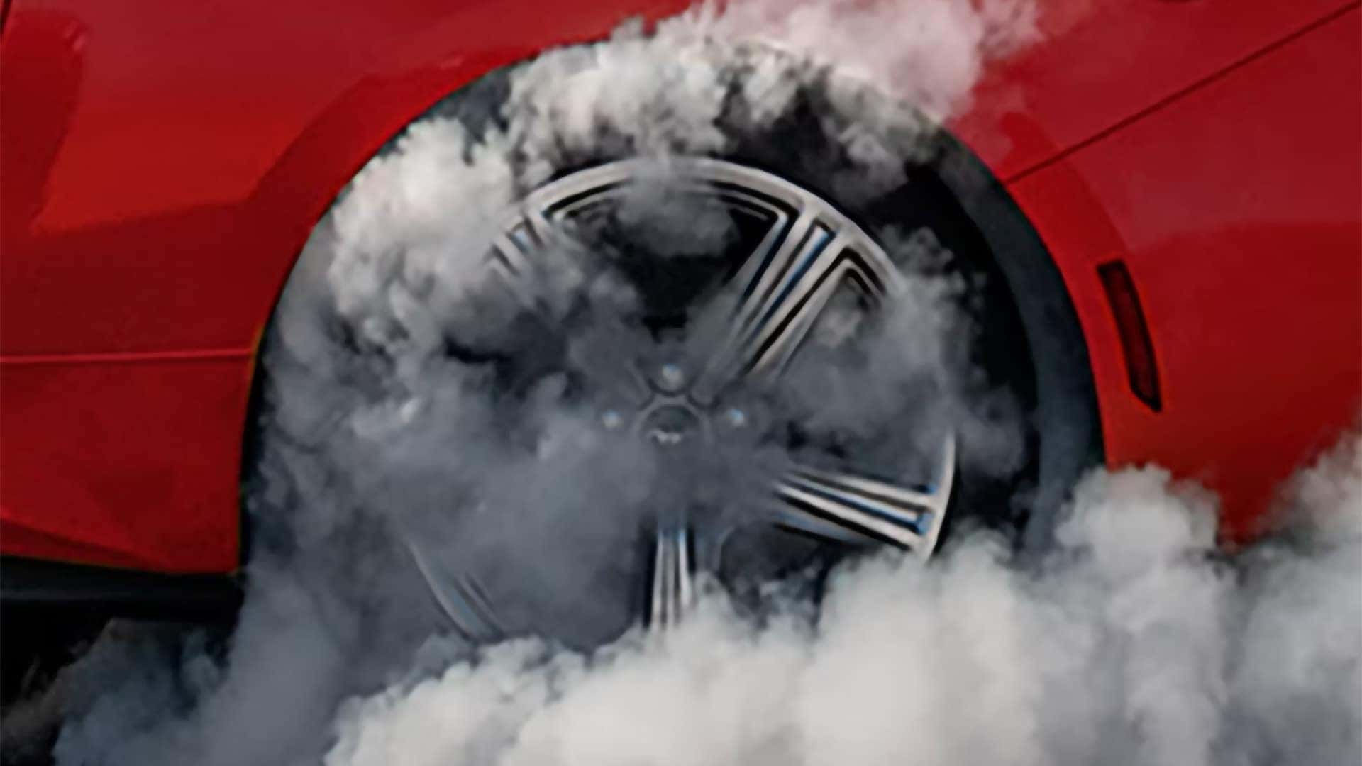 Close-up of a 2026 Ford Mustang rear wheel during a smoky burnout