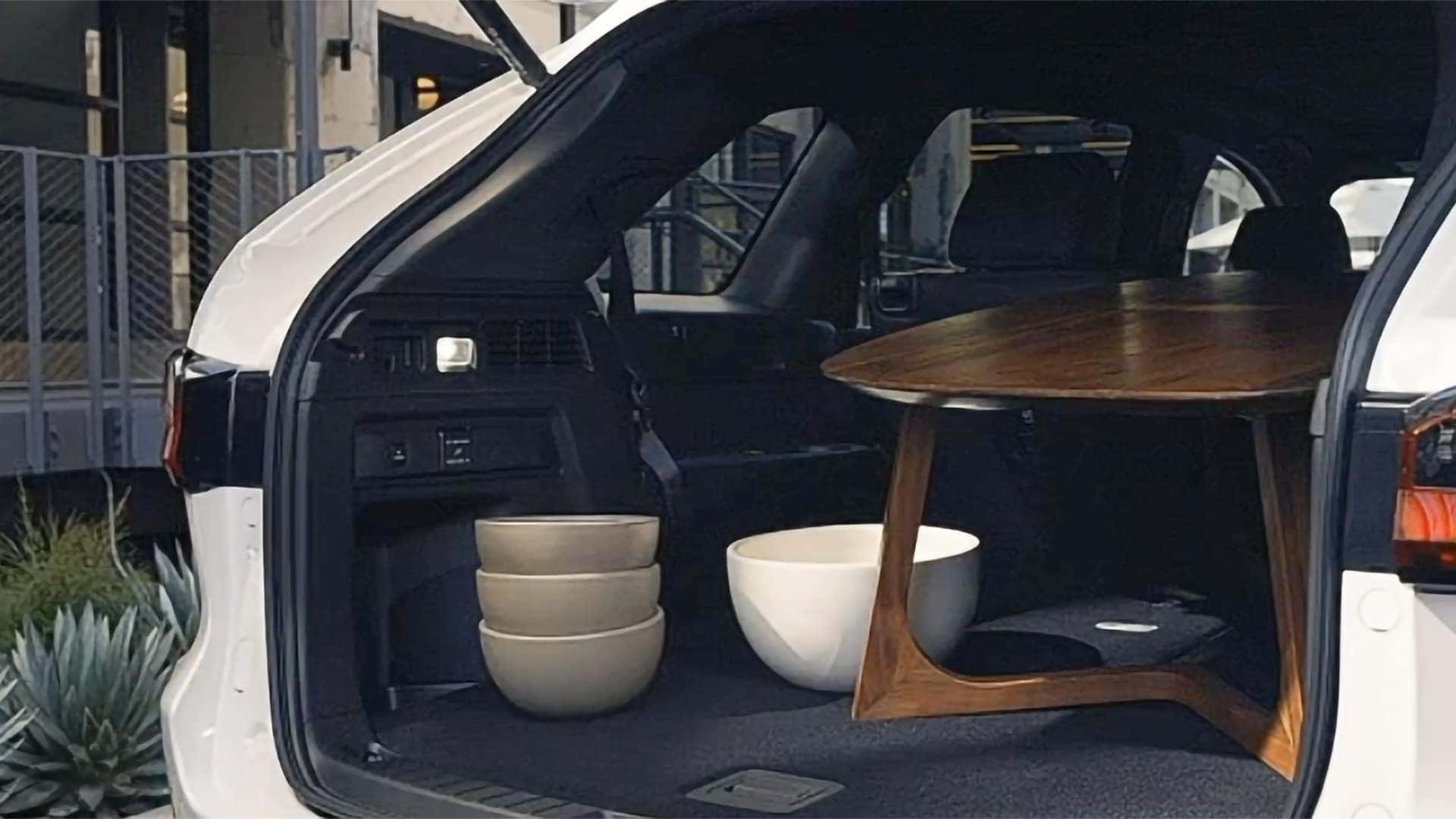 Table and pottery secured inside the expanded cargo area of a 2026 Mazda CX-90 PHEV