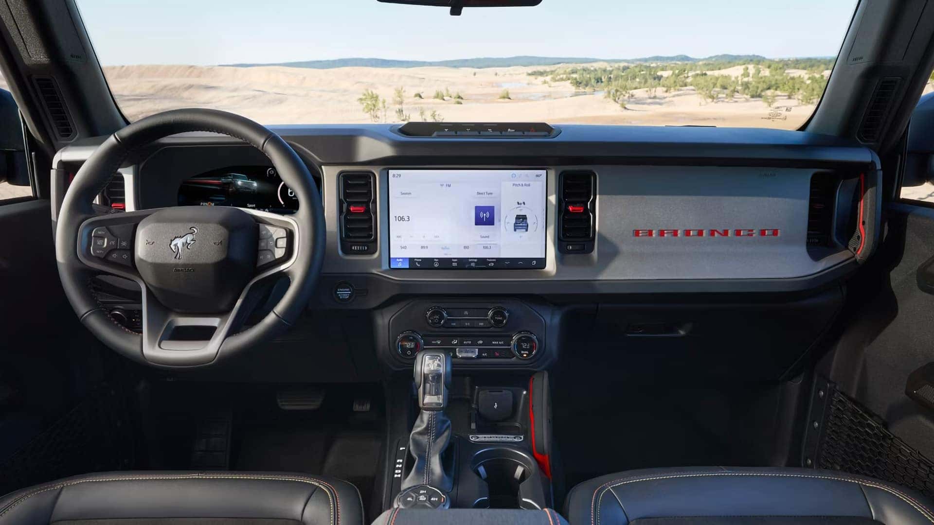2026 Ford Bronco dashboard with a digital instrument cluster, SYNC touchscreen, and four-wheel-drive controls