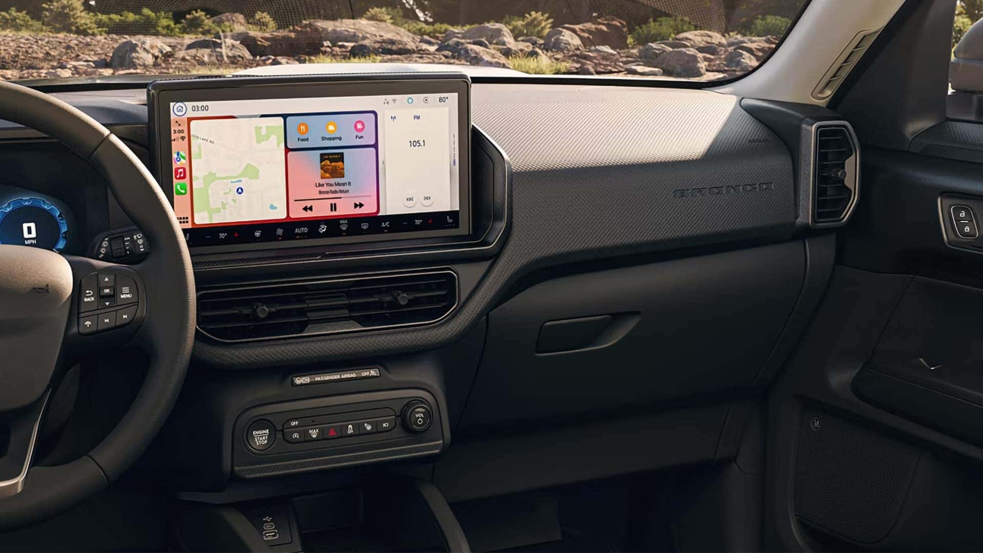 Ford Bronco Sport touchscreen displaying Apple CarPlay navigation and music playback controls
