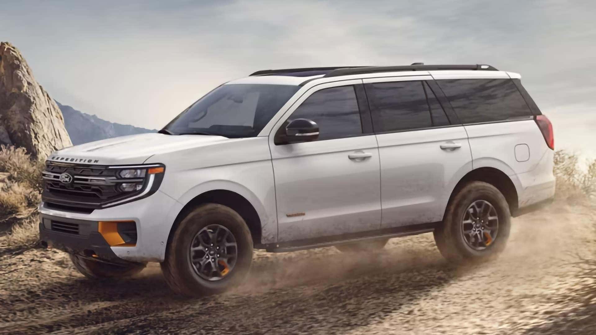 White 2026 Ford Expedition Tremor driving off-road, showing its full-size SUV exterior design