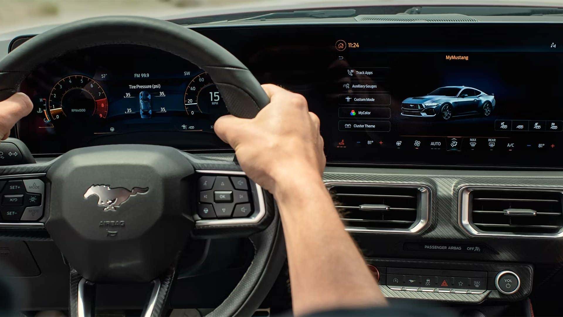 2026 Ford Mustang digital instrument cluster and center touchscreen viewed from the driver's seat