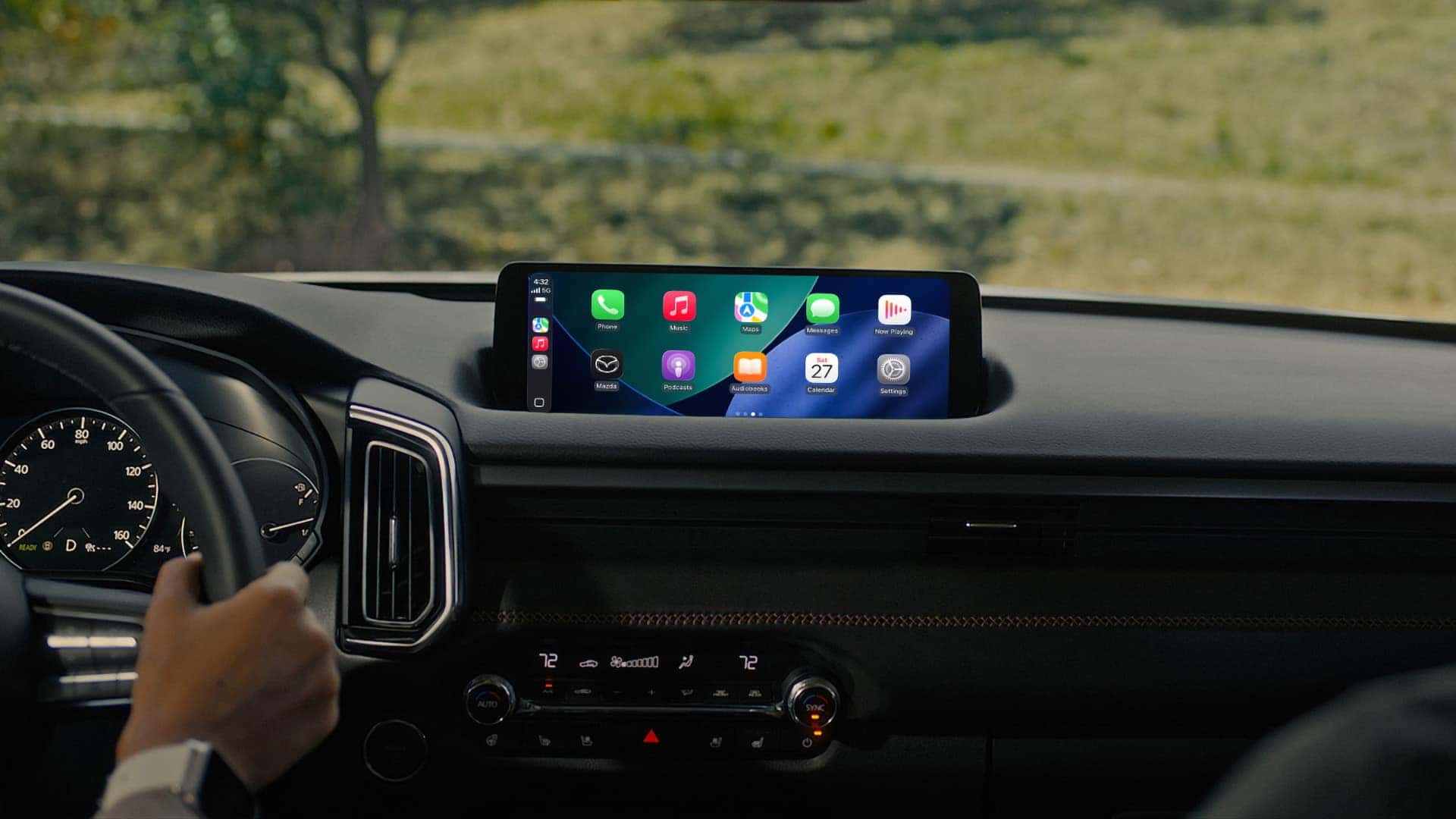 2026 Mazda CX-50 Hybrid infotainment display showing Apple CarPlay above the climate controls