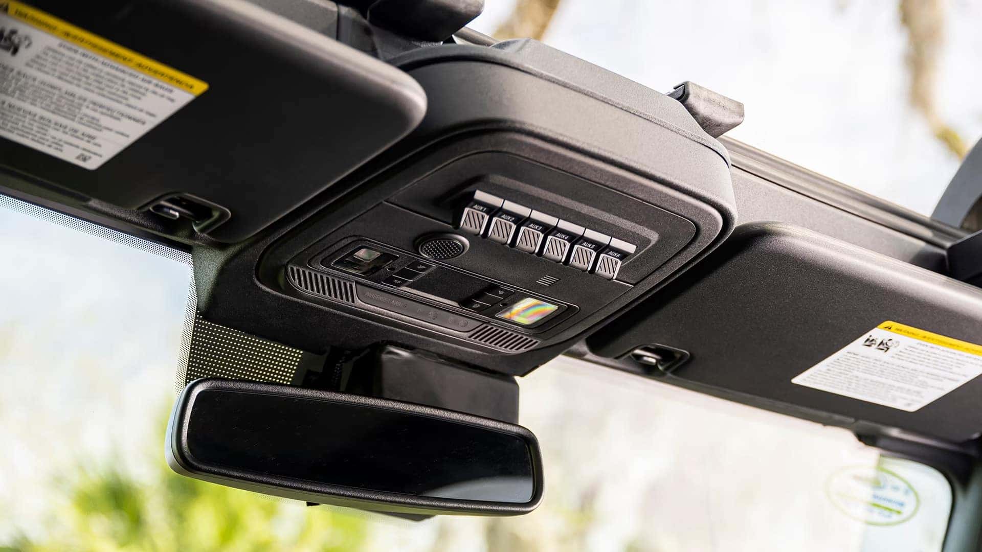 Overhead auxiliary switches and rearview mirror inside a 2026 Ford Bronco
