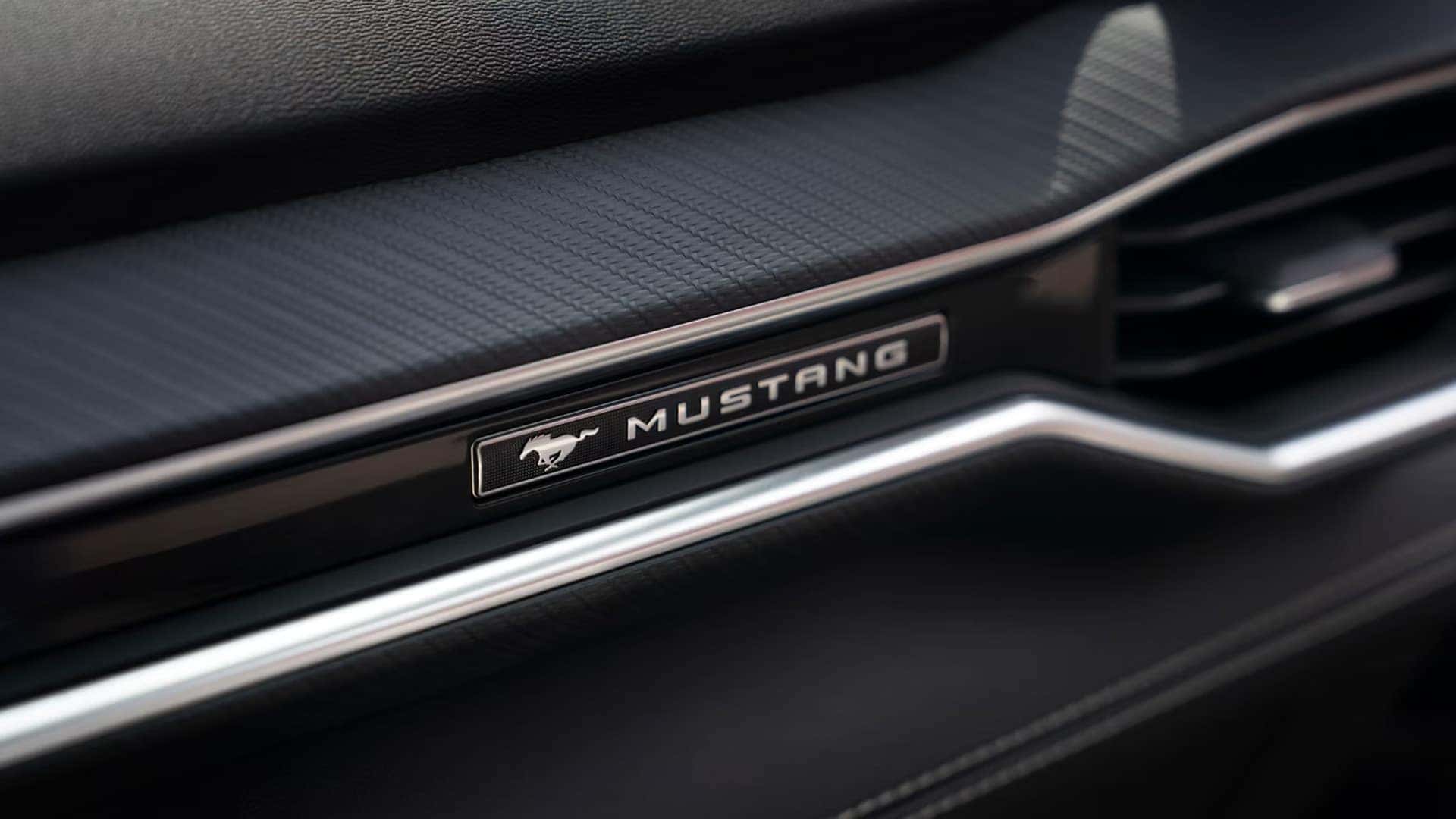 2026 Ford Mustang interior trim with Mustang badge on the passenger dashboard