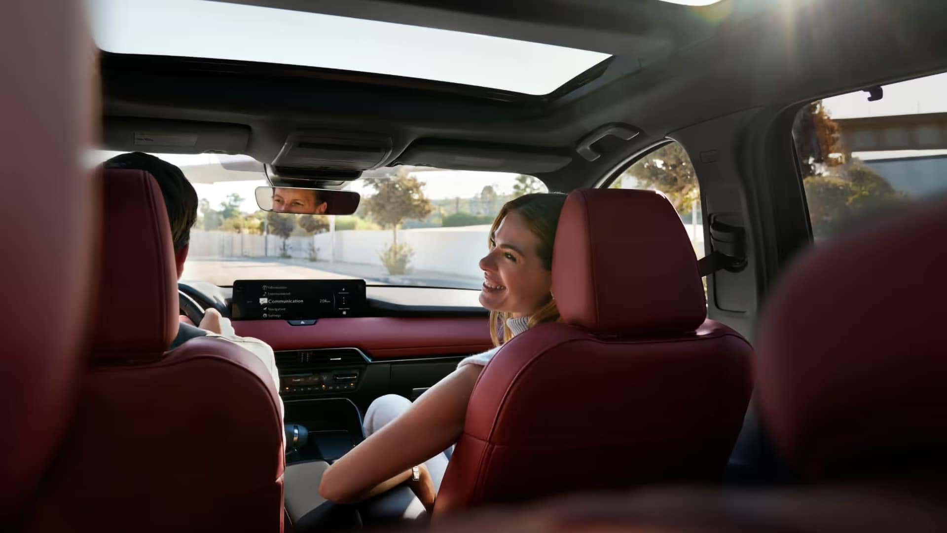 2026 Mazda CX-70 PHEV cabin with red leather seats and an open power sliding-glass moonroof