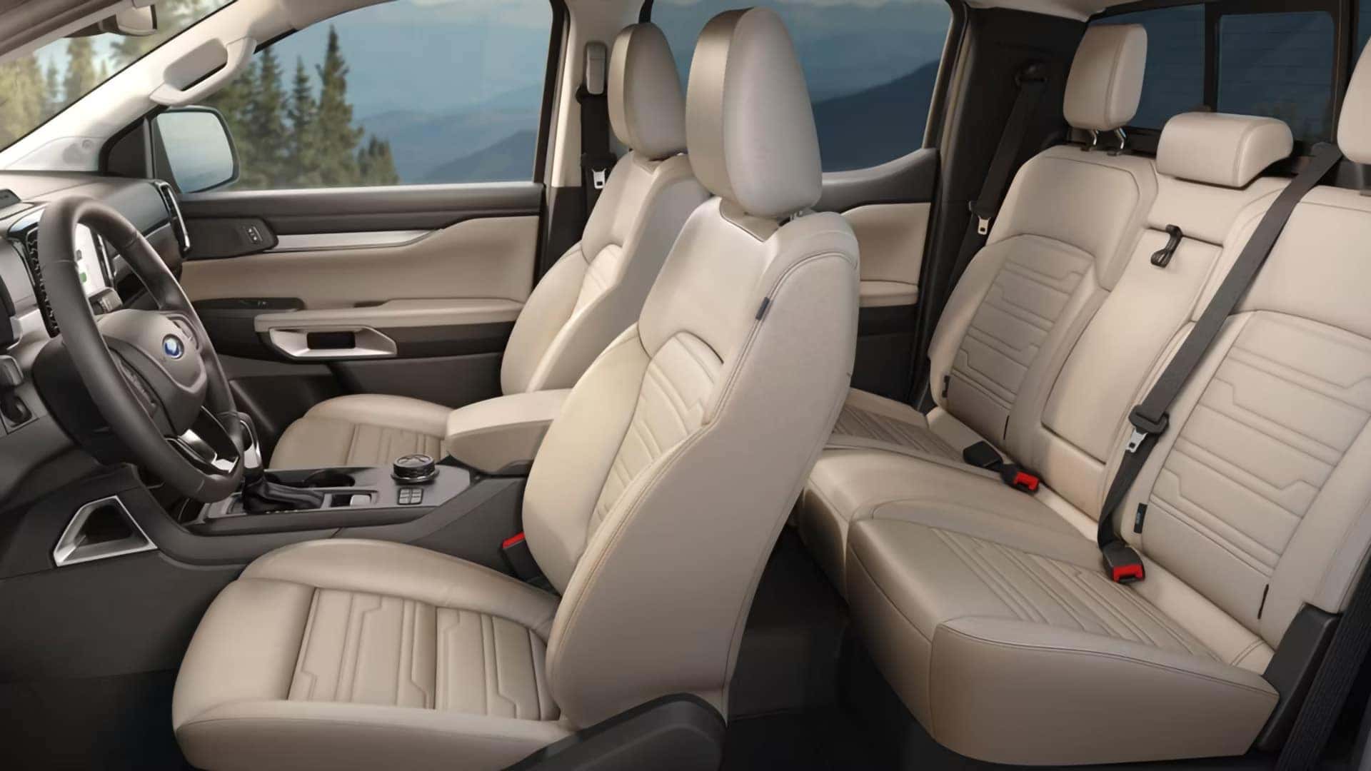 2026 Ford Ranger interior with light-colored front bucket seats and rear bench seating