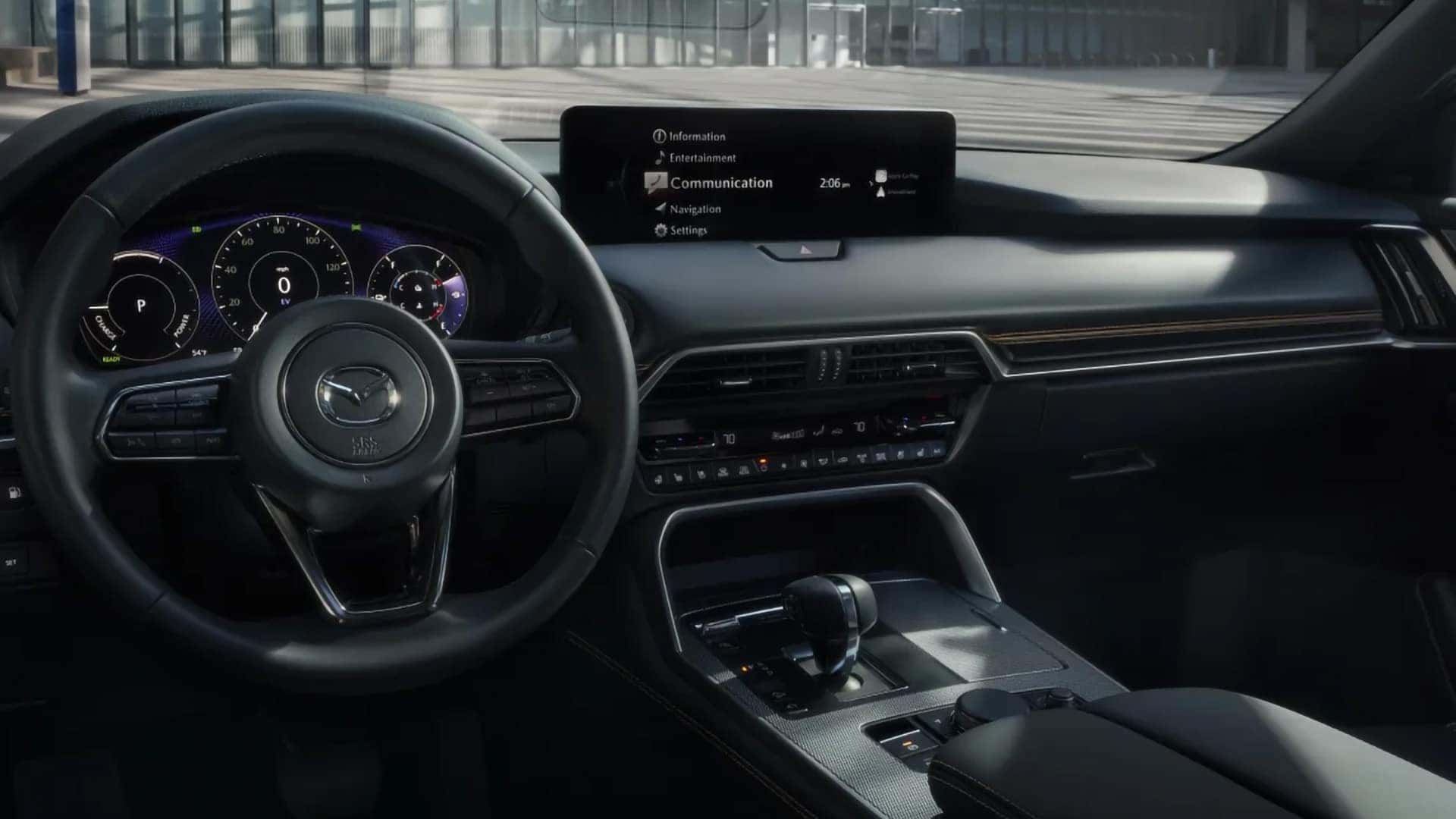 2026 Mazda CX-90 PHEV dashboard with digital gauges, center display, climate controls, and gear selector