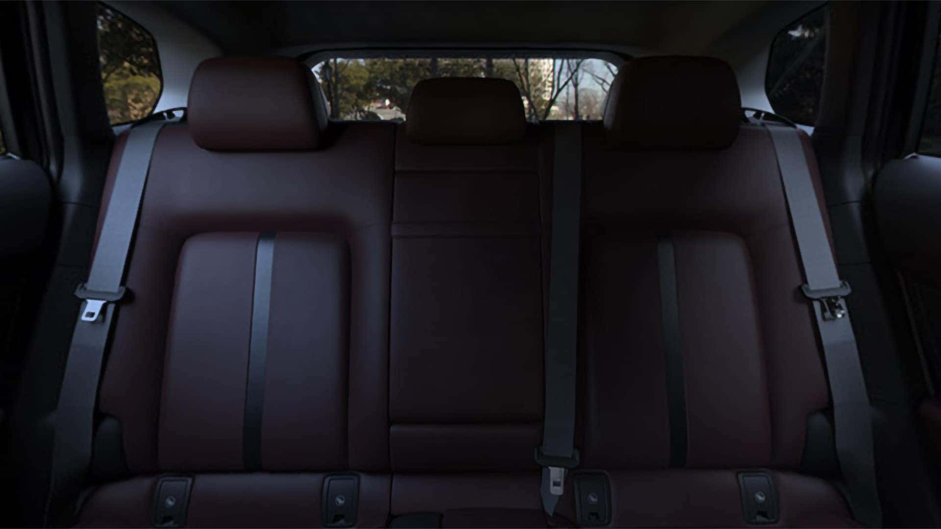 Red leather rear seats with three head restraints inside the 2026 Mazda CX-50 Hybrid